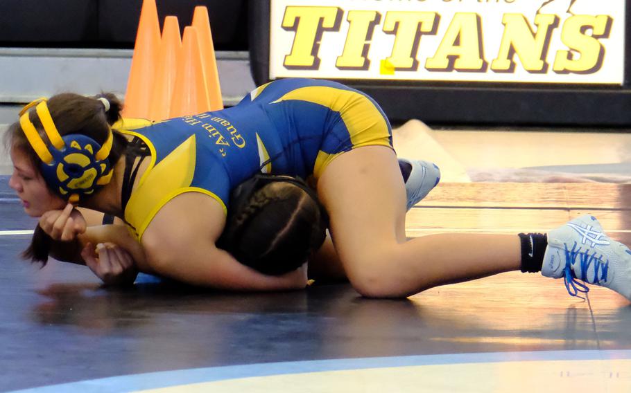 Guam High 119-pounder Caitlyn Bawar pins Southern's Dianna Appleby during Saturday's Guam wrestling quad meet. The Panthers edged the Dolphins 33-30 to win the meet.