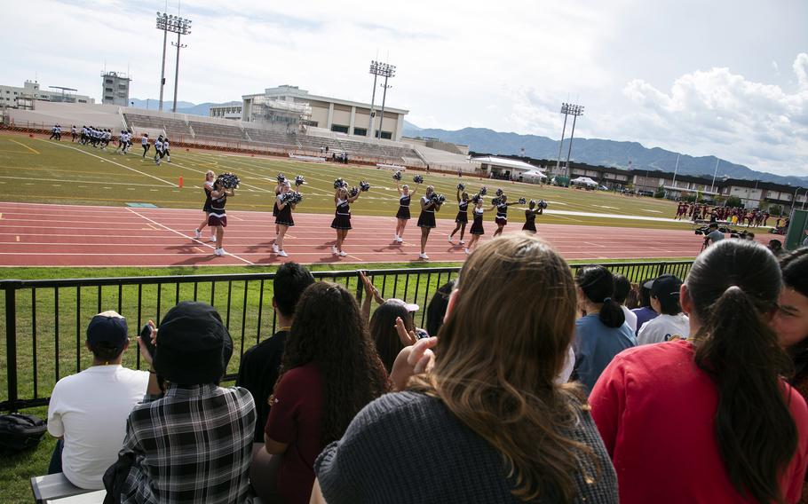 American and Japanese students watch a high school football game during the Student Educational Exchange and Dialogue camp at Matthew C. Perry High School, Marine Corps Air Station Iwakuni, Japan, Sept. 23, 2023.