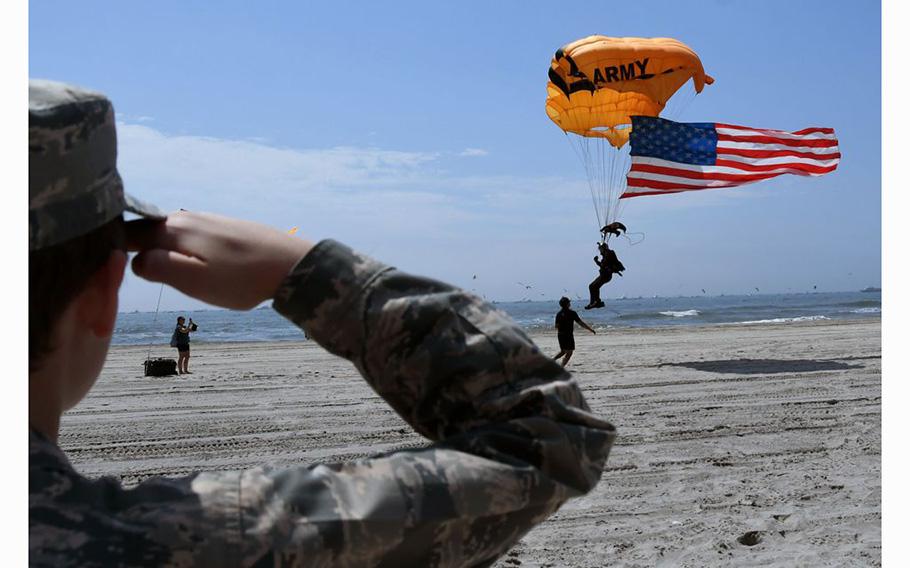 James Plock of the US Civil Air Patrol salutes as the US Army Golden Knights perform during the 2023 Visit Atlantic City Airshow on Wednesday, August 16, 2023.