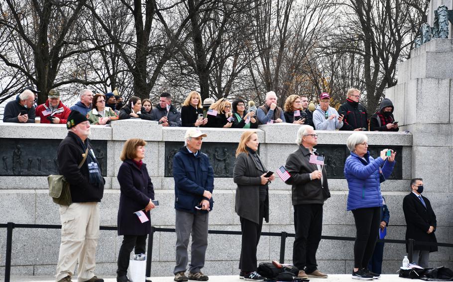 Onlookers watch the public remembrance for Sen. Bob Dole at the National World War II Memorial on Friday, Dec. 10, 2021.  