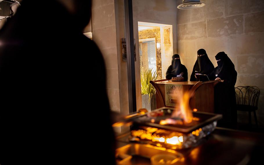Saudi women work at the reception desk of a local restaurant in Buraidah, Saudi Arabia, on Aug. 4, 2019. 