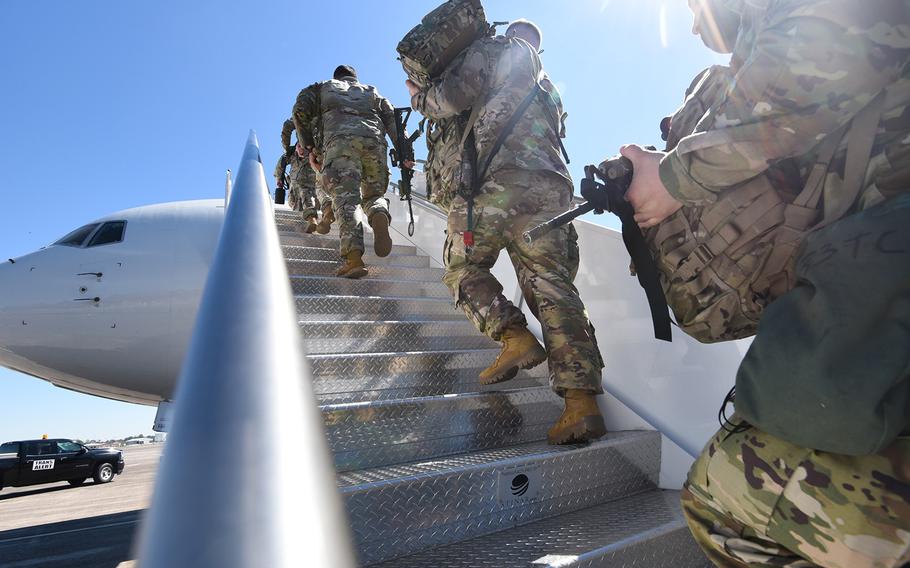 
Fort Stewart soldiers with the 3rd Battalion, 69th Armored Regiment of the 3rd Infantry Division’s 1st Armored Brigade Combat Team board a flight bound for Germany out of Hunter Army Airfield, Ga., on Wednesday, March 2, 2022. The brigade was ordered to Europe on a short-notice deployment after Russia invaded Ukraine. 