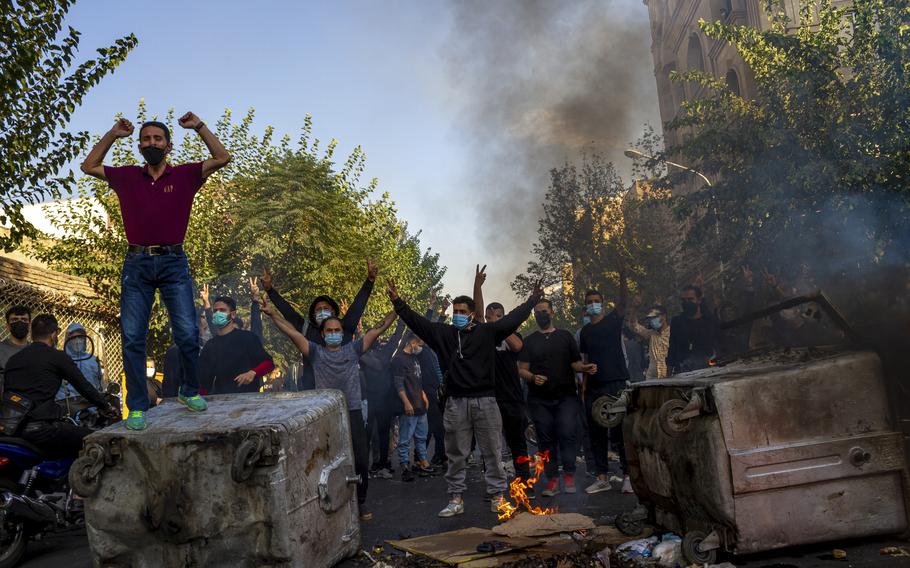 In this photo taken by an individual not employed by the Associated Press and obtained by the AP outside Iran, Iranians protests the death of 22-year-old Mahsa Amini after she was detained by the morality police last month, in Tehran, Thursday, Oct. 27, 2022. 