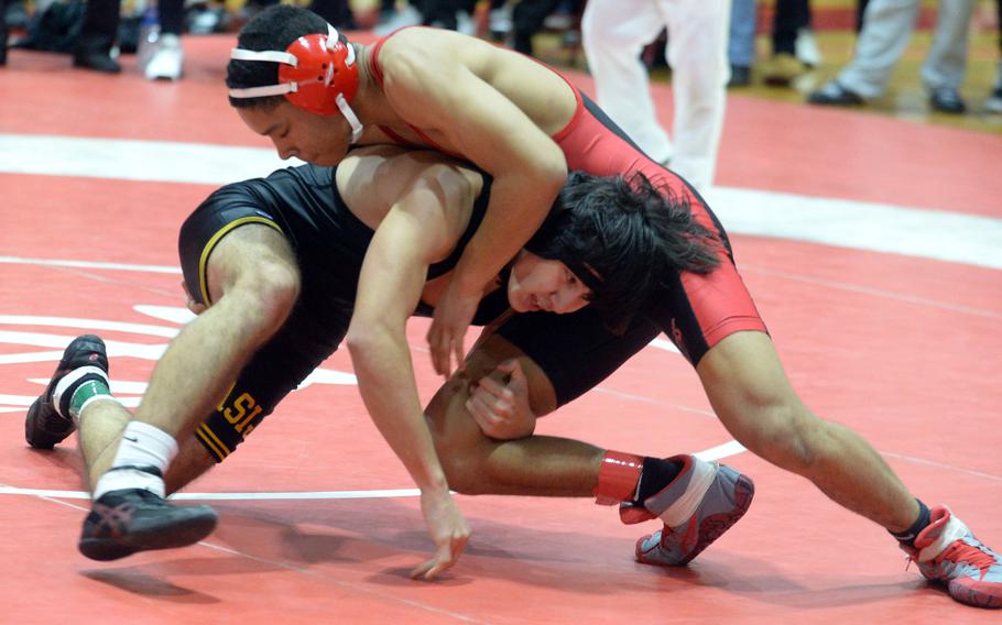 Nile C. Kinnick 145-pounder Will Mitchell gains control of American School In Japan's Julian Drysdale. Mitchell won the final by pin in 2 minutes, 19 seconds.