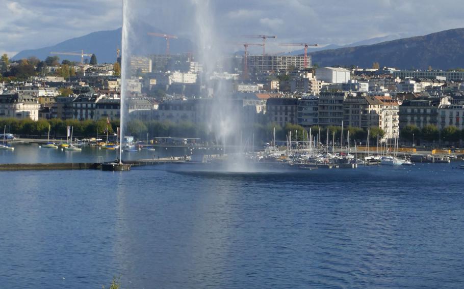 Lake Geneva, the Jet d’Eau fountain and a mouette, or yellow shuttle boats.