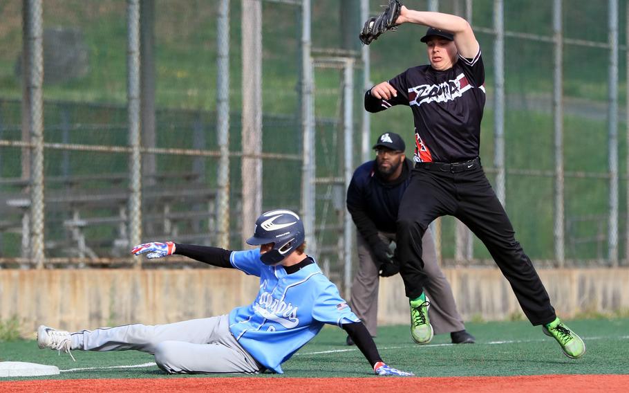 Osan's Lonzo Martin slides safely into third base ahead of the throw to Zama's Caleb Schmiedel.