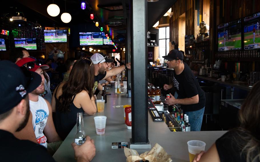 Customers at a bar in Detroit on Aug. 8, 2021. 