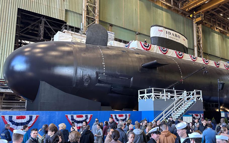 Spectators gather to observe a christening of the Idaho (SSN 799) during a ceremony at General Dynamics Electric Boat shipyard facility in Groton, Conn., Saturday, March 16, 2024. 