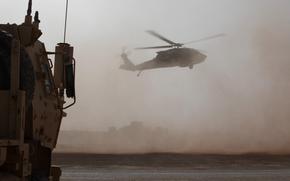 A U.S. Army UH-60 Black Hawk, carrying French Army Brig. Gen. Olivier Celo, Combined Joint Task Force - Operation Inherent Resolve Director of Civil Affairs,  lands to meet with Syrian Free Army commander Col. Abu Turki at Al-Tanf Garrison, Syria, April 6, 2025. The meeting was focused on highlighting the cooperation between their forces spanning the past nine years, resulting in the territorial defeat of ISIS. The Coalition continues to work with Syrian partner forces to promote the safety and security of civilians and partner forces. (U.S. Army photo by Staff Sgt. Fred Brown)