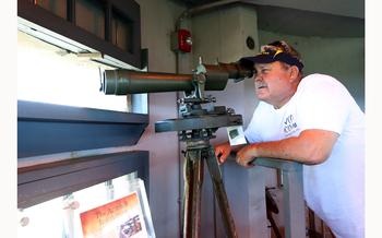 Mark Allen, a local historian, looks through the azimuth atop Fire Control Tower No. 23, in Lower Township, Wednesday, June 1, 2022. It was built in 1942 for use during World War II.