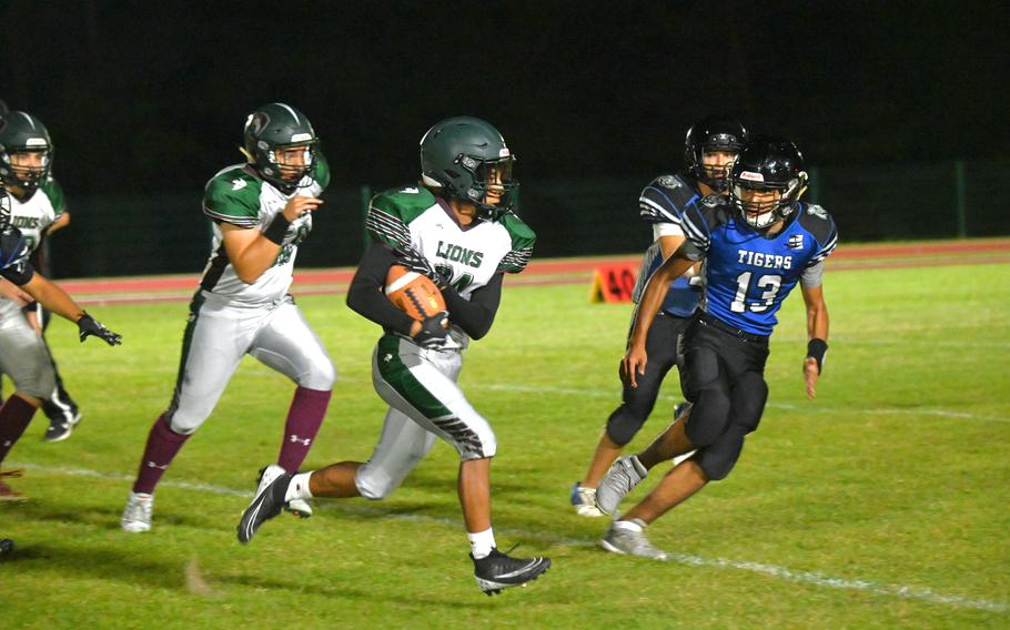 AFNORTH’s Everett Reeves takes the ball downfield in the second half of a football game against the Hohenfels Tigers on Sept. 29, 2023 at Hohenfels Middle High School.