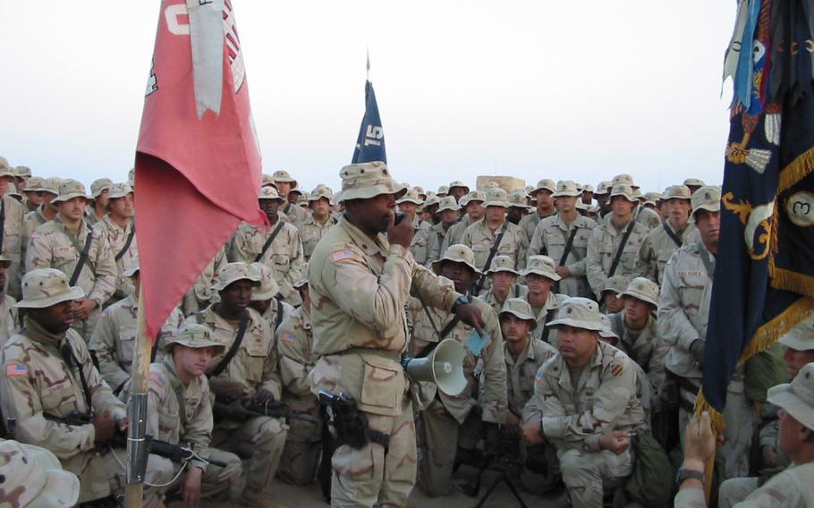 Army Lt. Col. Stephen Twitty addresses U.S. 3rd Infantry Division troops at an encampment in Kuwait shortly before the U.S.-led invasion of Iraq in 2003. 