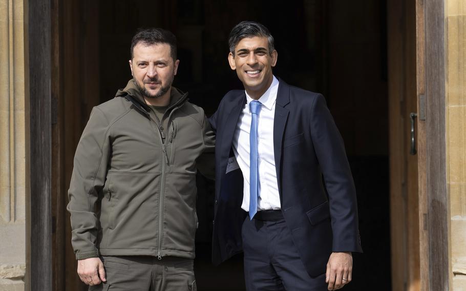 Britain Prime Minister Rishi Sunak, right, greets Ukraine President Volodymyr Zelenskyy after his arrival at Chequers, in Aylesbury, England, Monday, May 15, 2023. 