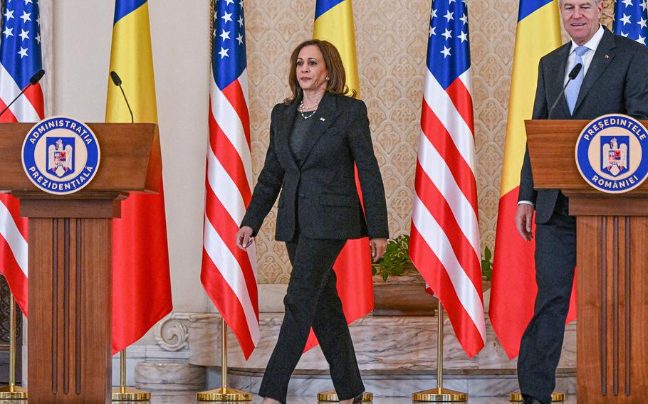 U.S. Vice President Kamala Harris and Romanian President Klaus Iohannis  arrive for a press conference at Cotroceni Palace, the Romanian Presidency headquarters, in Bucharest, Romania, March 11, 2022. 