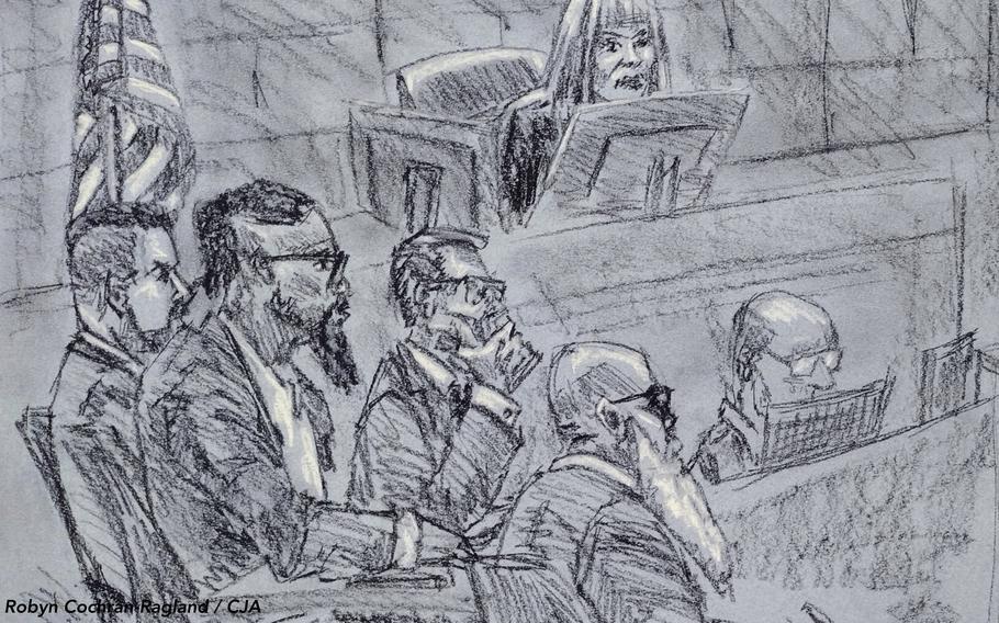 A courtroom sketch shows a defendant sitting with three lawyers in front of the judge.
