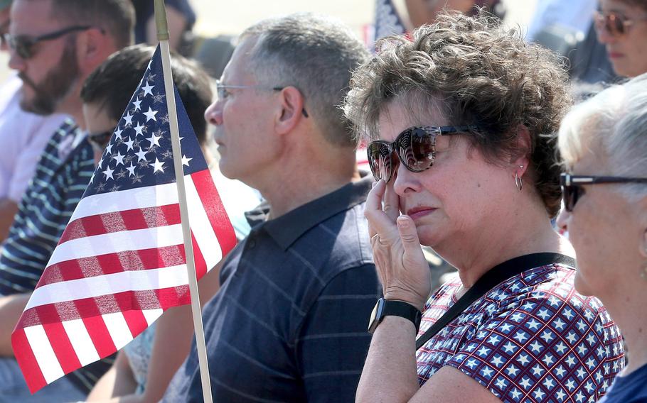 Kathy Patron holds the American flag and wipes away a tear during a 10th anniversary memorial service for her son, Marines Sgt. Daniel Patron, in Perry Township on Saturday, Aug. 21, 2021. Patron died Aug. 6, 2011, while defusing a roadside bomb while serving in Afghanistan.