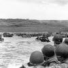 Troops watch activity ashore on Omaha Beach as their LCVP landing craft approaches the shore on D-Day, 6 June 1944. 