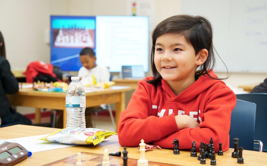 Hiromasa Shilt, a second-grader at Shirley Lanham Elementary School, plays chess against a local Japanese student during a tournament at Naval Air Facility Atsugi, Japan, Feb. 23, 2024.