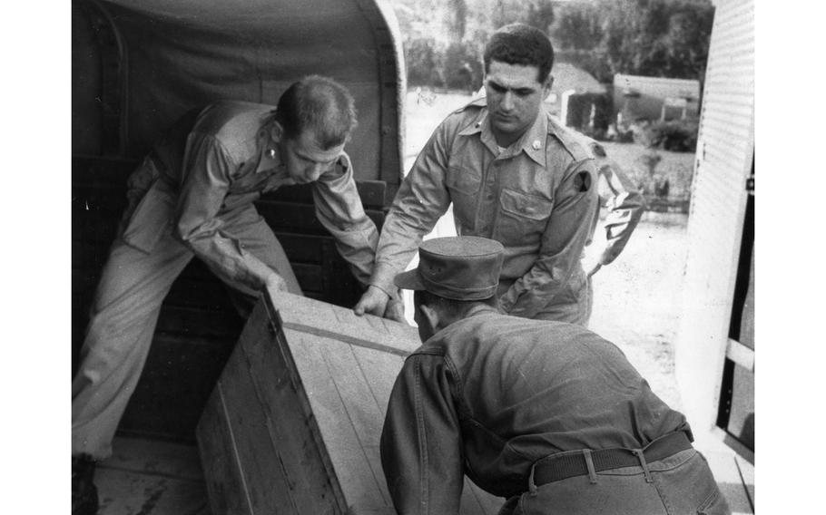 A crew unloads set pieces for the 7th Infantry Division Special Services “soldier show,” to be performed later that day in Seoul, South Korea. After touring various bases and venues throughout Korea in September 1956, the show would move to perform in Japan the next month.