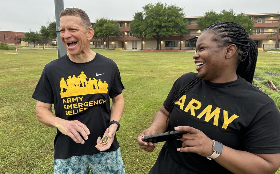 Tony Grinston, CEO of Army Emergency Relief and the 16th Sergeant Major of the Army, reacts April 25, 2024, to watching a video created by Sgt. 1st Class Latoya Greene, a content creator stationed at Fort Cavazos, Texas. Grinston attended a group workout and professional development session led by Greene for soldiers of the 20th Engineer Battalion.