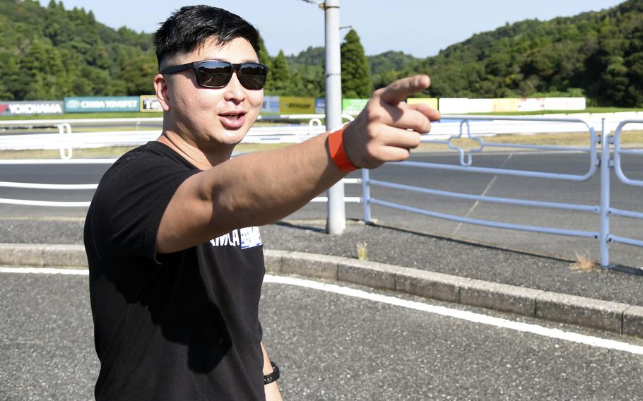 Capt. Joseph Chong, an intelligence officer stationed at Camp Zama, near Tokyo, explains the layout of Mobara Twin Circuit during a Butcher Style Racing 88 event in Chiba, Japan, Sept. 7, 2024.