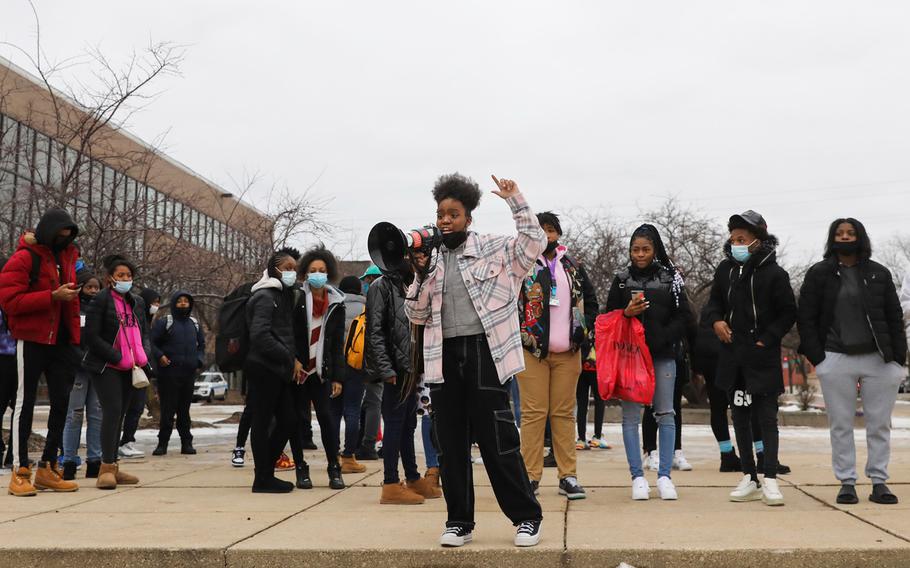 Student Catlyn Savado, center, addresses students at Percy Julian High School in Chicago as many students walk out of school over school safety issues on Friday, Jan. 14, 2022. 