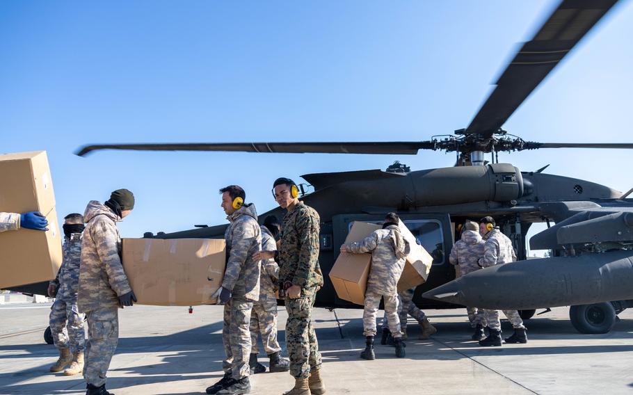 A U.S. Army UH-60M Black Hawk assigned to 1st Armored Division, Combat Aviation Brigade, is loaded with relief supplies at Incirlik Air Base, Turkey, Feb. 21, 2023.
