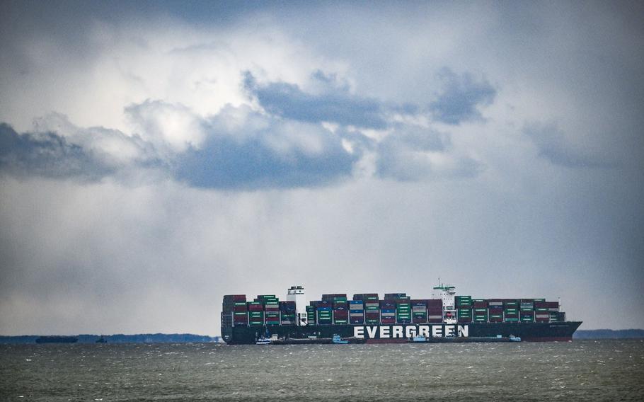 Dredges work to free the grounded Ever Forward container ship after it ran aground outside the shipping channel a few weeks ago.