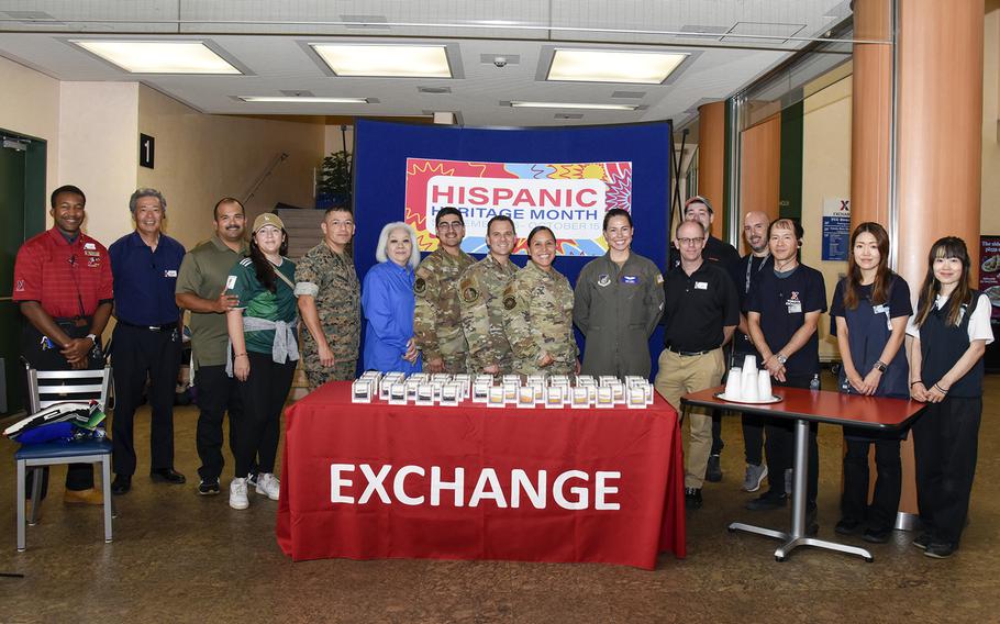 Community members at Yokota Air Base in western Tokyo pose during a Hispanic Heritage Month celebration at the base community center, Sept. 15, 2023.