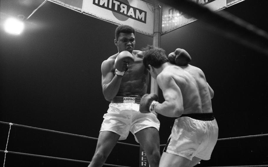 Muhammad Ali takes on German boxer Karl Mildenberger in the ring at the Waldstadion in Frankfurt, Germany, on Sept. 10, 1966. 
