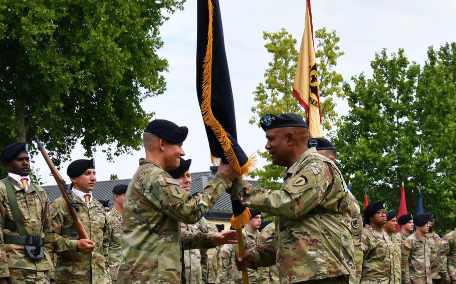 Gen. Darryl Williams, commander of U.S. Army Europe and Africa, right, passes the U.S. Army Southern European Task Force, Africa guidon to Maj. Gen. Todd Wasmund, incoming SETAF-AF commander, during the change of command ceremony at Caserma Ederle in Vicenza, Italy, July 14, 2022.