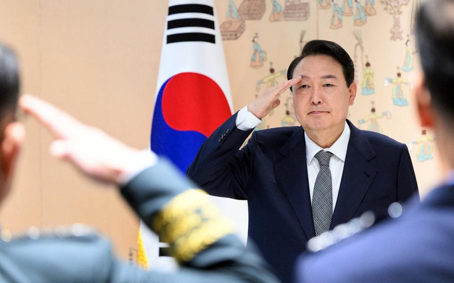 South Korean President Yoon Suk Yeol salutes during a military promotion ceremony in Seoul, South Korea, May 27, 2022.