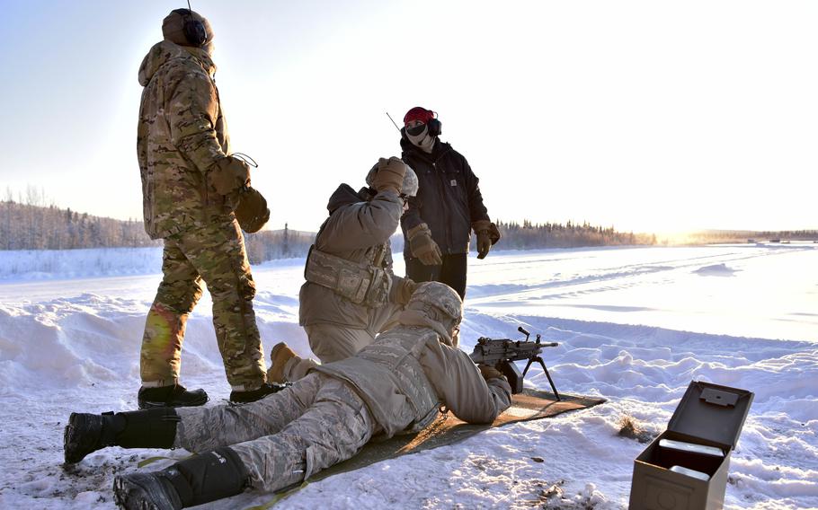 Instructors with the 354th Security Forces Squadron Combat Arms Training and Maintenance unit oversee airmen preparing to fire an M-249 squad automatic weapon at Eielson Air Force Base, Alaska, Jan. 9, 2020. 
