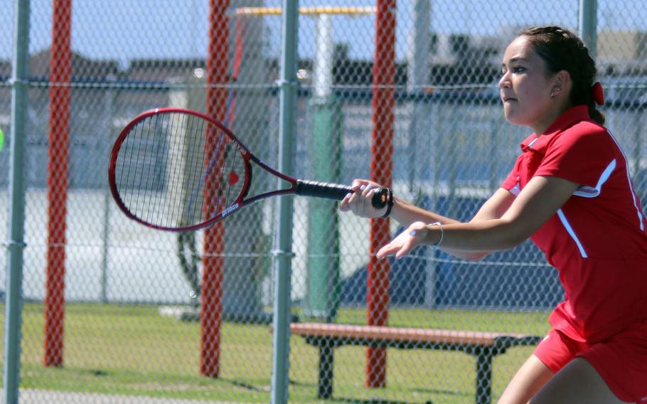 Nile C. Kinnick's Emily Paul hits a forehand return against Matthew C. Perry's Julie Apperson during Saturday's tennis mataches. Paul won her singles match 8-1.