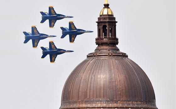 Jets fly past the Naval Academy Chapel dome. The Blue Angels performed a practice show Tuesday, May 23, 2023, in Annapolis to prepare for the Naval Academy Commissioning Week show tomorrow. (Paul W. Gillespie/Staff)