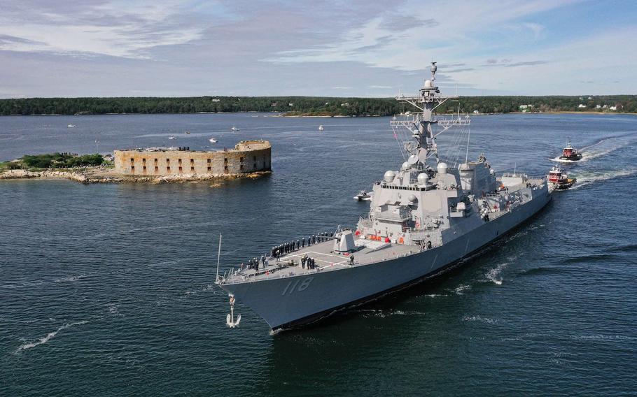 The future USS Daniel Inouye (DDG 118) transits the Kennebec River, sailing away from General Dynamics Bath Iron Works shipyard in Bath, Maine, on Oct. 4. The ship will be in Newport on Friday.