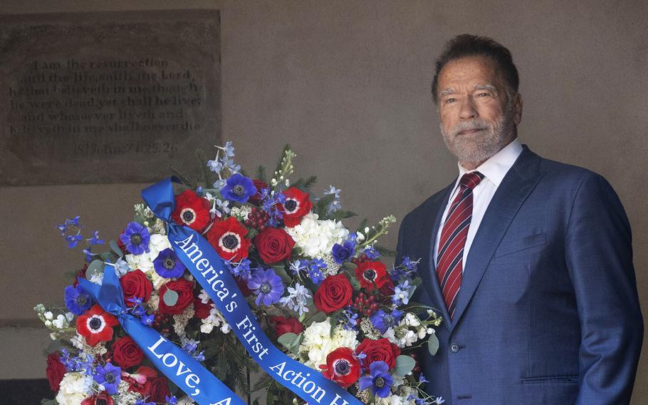 Former California governor Arnold Schwarzenegger posing for a photo after placing a wreath honoring George Washington.