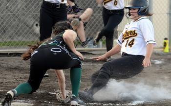 Kubasaki's Landry Murray tags out Kadena's Lia Connolly at home plate during Tuesday's DODEA-Okinawa softball game. The Panthers won 18-3 in four innings.