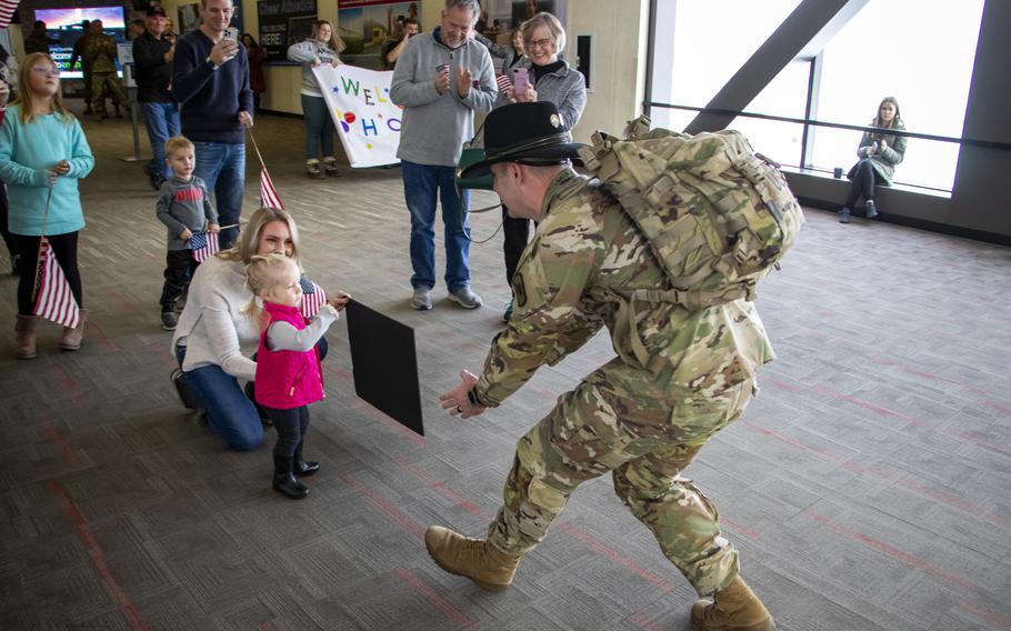 Capt. Jon Gronewold is greeted by family and friends, including his wife Emily and daughter Ada, 2, during his welcome home Jan. 13, 2024, at Eppley Airfield in Omaha, Neb.