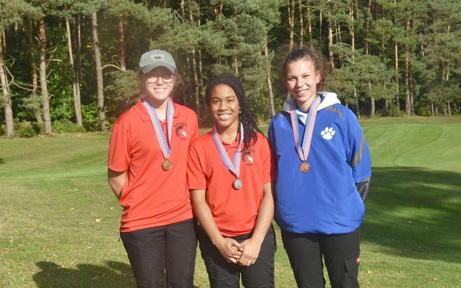 The top three girls pose for a picture after recieving their medals at the DODEA-Europe golf championships held at Wiesbaen’s Rheinblick Golf Course on Thursday, Oct. 7, 2021. Kaiserslautern’s Reigen Pezel, from left, and Asia Andrews finished first and second. Ramstein’s Carleigh Rivera, the defending champion, was third.