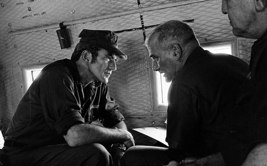 Chief of Naval Operations Adm. Elmo R. Zumwalt Jr. (left) and Rear Adm. Robert S. Salzer, Commander Naval Forces Vietnam, discuss their recent visit to Nam Can Naval Base in Vietnam in May 1971.