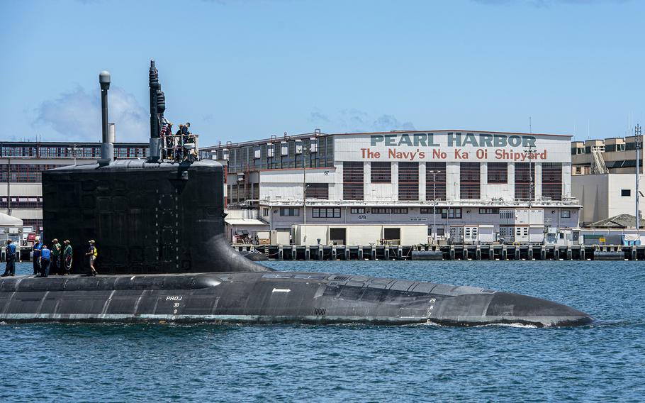 A Virginia-class fast-attack submarine departs Pearl Harbor Naval Shipyard in Hawaii, May 10, 2020. A Navy nuclear engineer and his wife have been charged with repeatedly trying to pass along secrets on the design, operations and performance of Virginia-class nuclear submarine reactors, according to court documents.