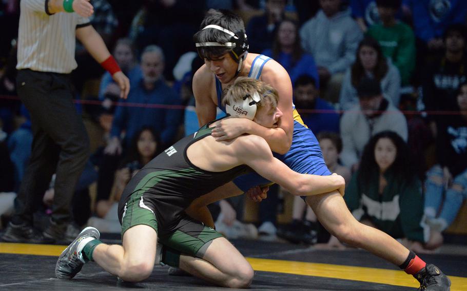 Wiesbaden’s Antonio Gutierrez grapples with AFNORTH’s Deacon Smith in the 138-pound final at the DODEA-Europe wrestling championships, in Wiesbaden, Germany, Feb. 11, 2023. Gutierrez won the match.