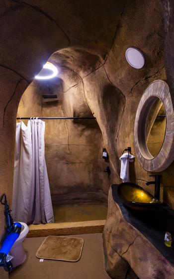 Inside an OutpostX cave bathroom.