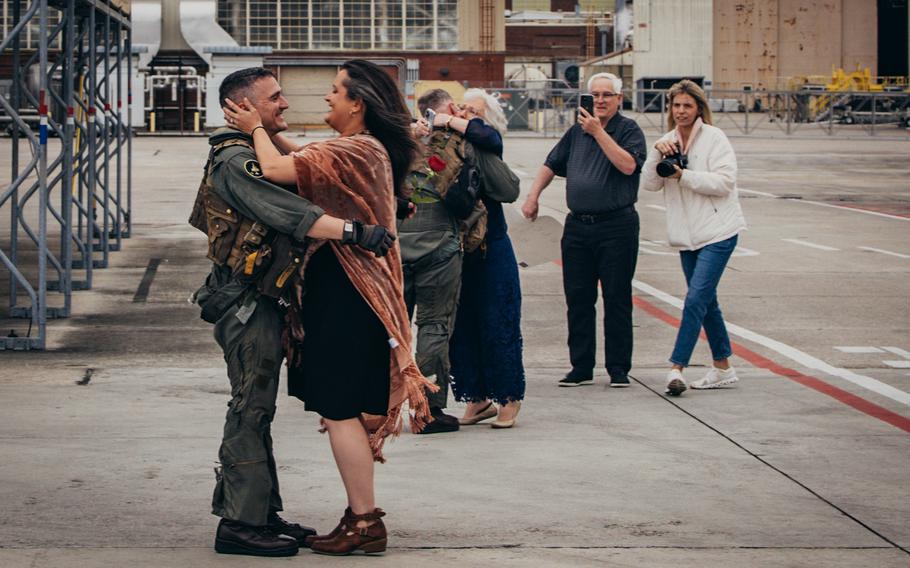 U.S. Marine Maj. Brian Neri, an AV-8B Harrier pilot assigned to Marine Attack Squadron 231 Detachment, Marine Medium Tiltrotor Squadron 162 (Reinforced), 26th Marine Expeditionary Unit (Special Operations Capable) is reunited with his wife after returning from deployment at Marine Corps Air Station Cherry Point, N.C., Saturday, March 16, 2024.