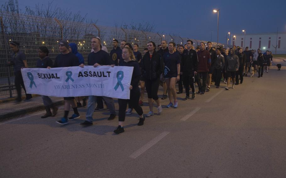Military personnel and civilians onboard Naval Support Activity Naples take part in the annual Silent March, April 17, 2015. 