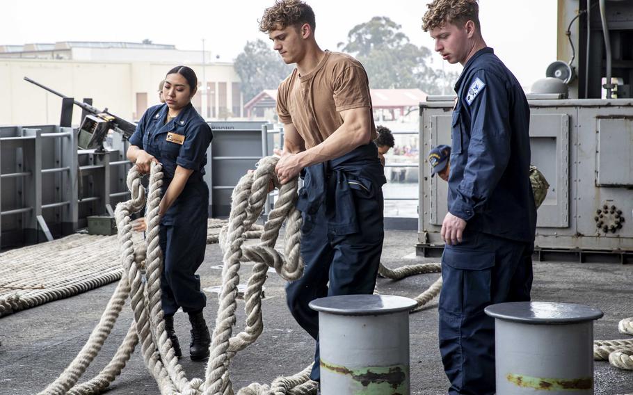 Sailors prepare to fake down lines on the USS Abraham Lincoln