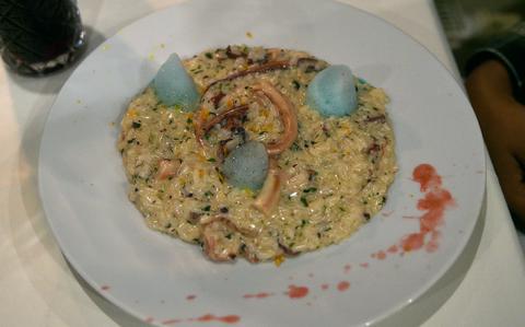 Risotto at Piemont Restaurant in Kirchheimbolanden, Germany, is served with octopus, orange peels, basil and lemon foam. The meal costs 16.90 euros.