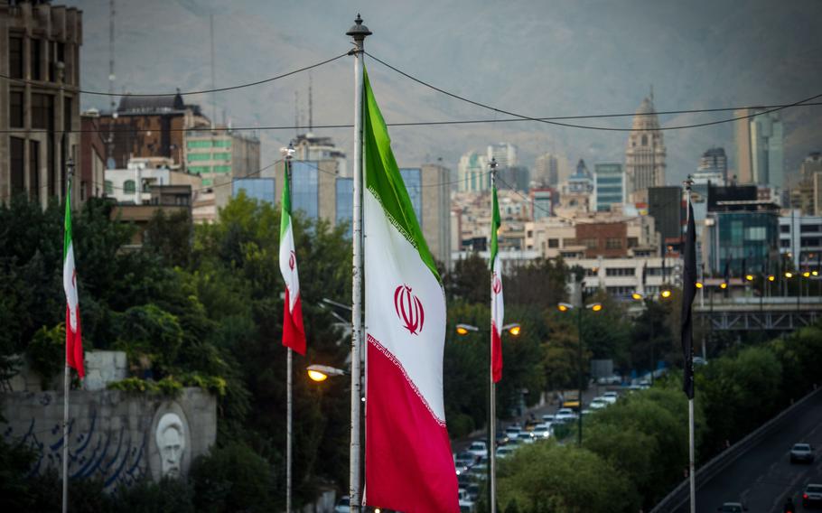 Iranian national flags fly near a major highway through Tehran, Iran, on Sept. 17, 2019.