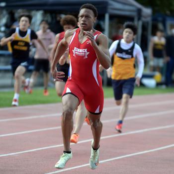 Nile C. Kinnick junior Jeremiah Hines charges for the finish en route to a sweep of the 100, 200 and 400 during Saturday's DODEA-Japan district track finals.